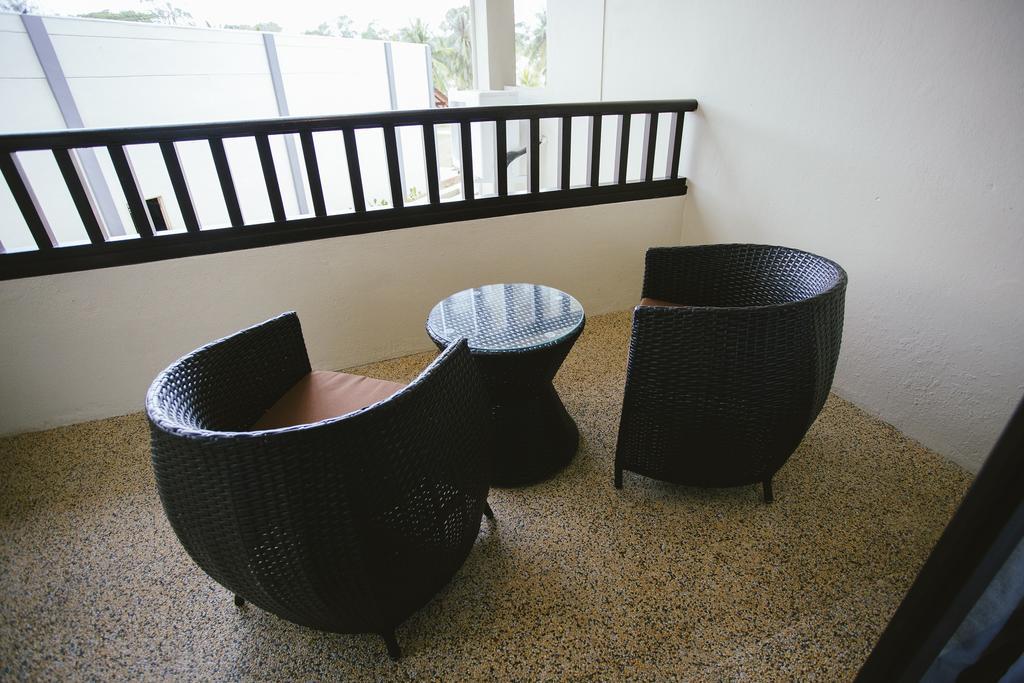Sand & Sandals Desaru Beach Resort & Spa Екстер'єр фото A set of outdoor furniture